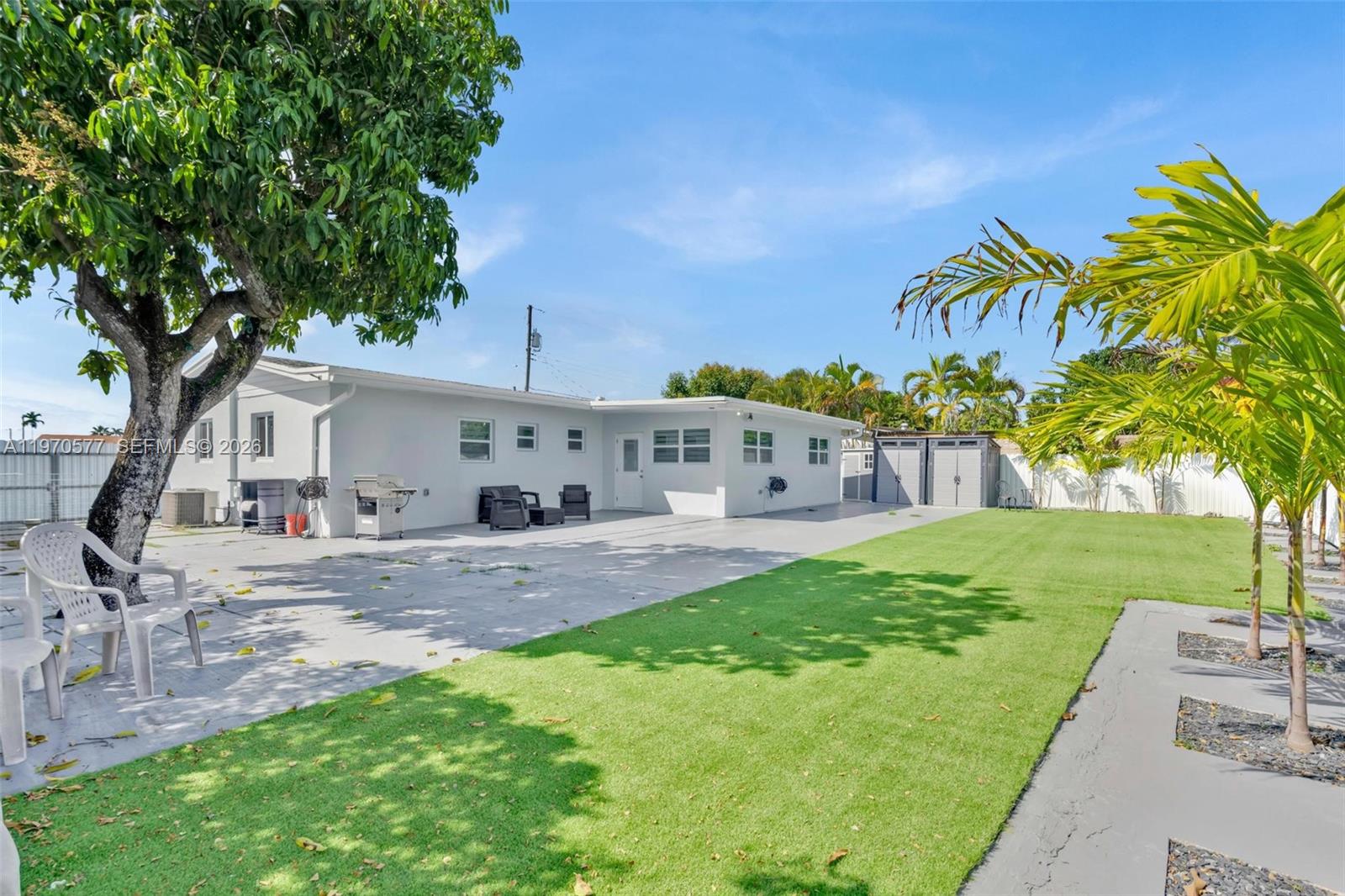 5521 Southwest 104th Avenue Miami, FL 33165 - Photo 24 of 28 a front view of a house with garden
