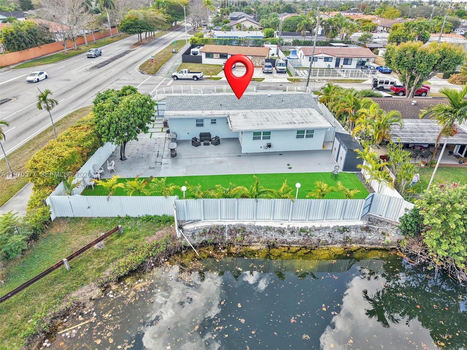 5521 Southwest 104th Avenue Miami, FL 33165 - Photo 27 of 28 a view of a swimming pool with a yard and plants