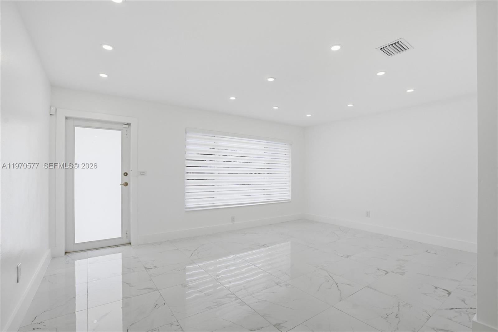 5521 Southwest 104th Avenue Miami, FL 33165 - Photo 7 of 28 a view of an empty room with a window