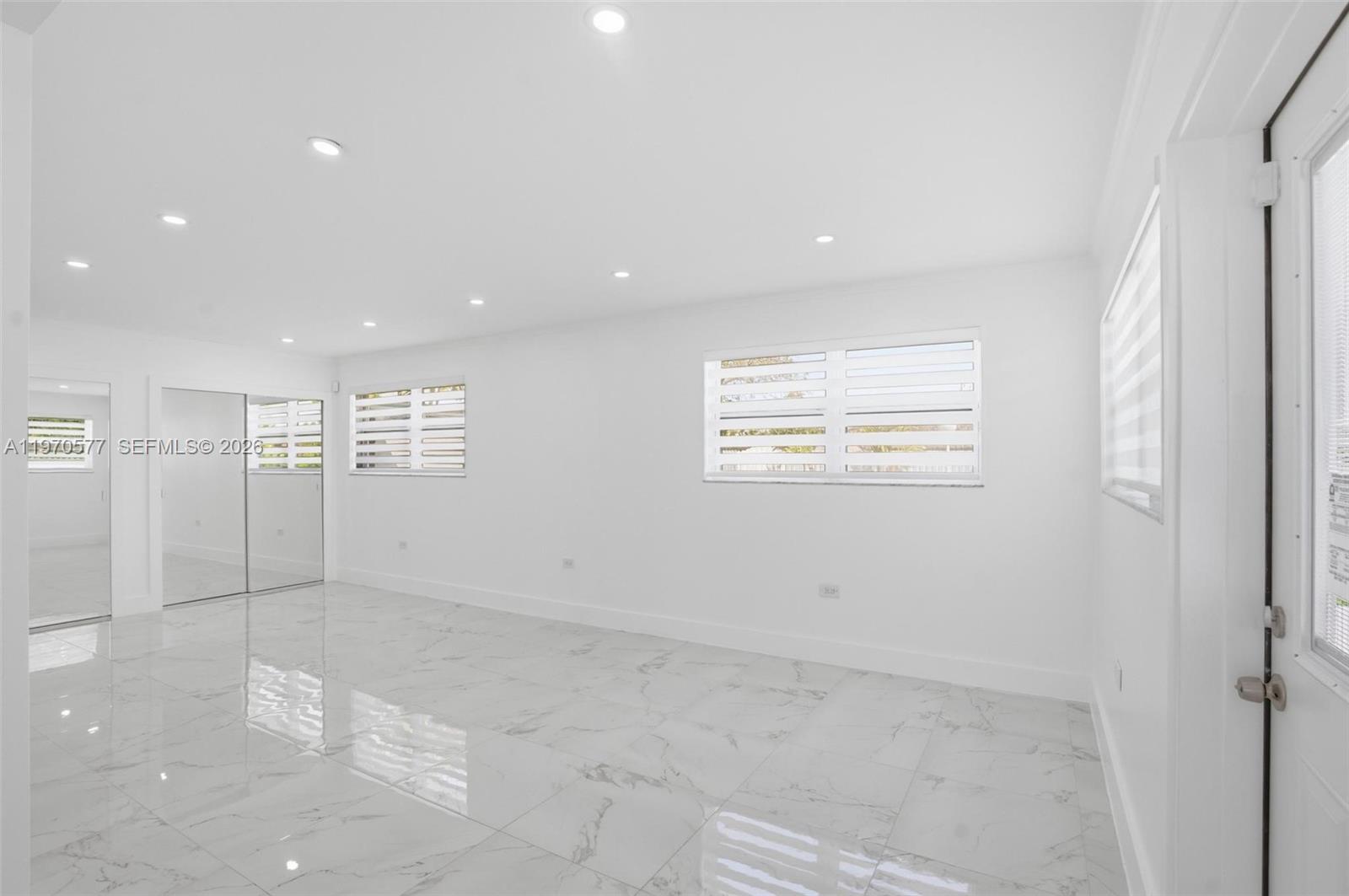 5521 Southwest 104th Avenue Miami, FL 33165 - Photo 10 of 28 a view of an empty room with a window