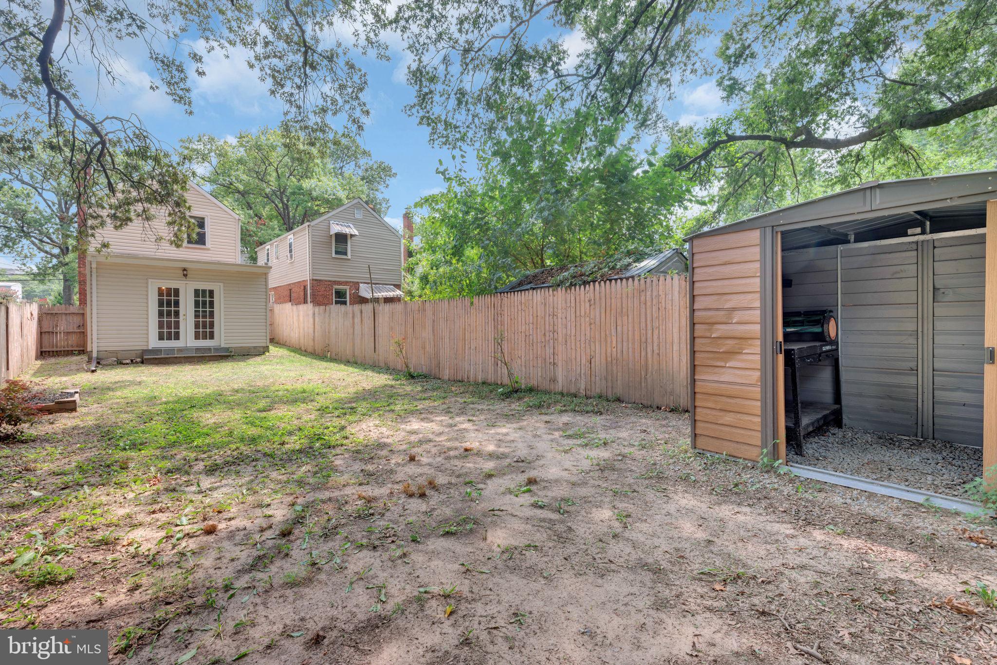 2842 30th Street Northeast Washington, DC 20018 - Photo 14 of 18 a view of a house with a backyard