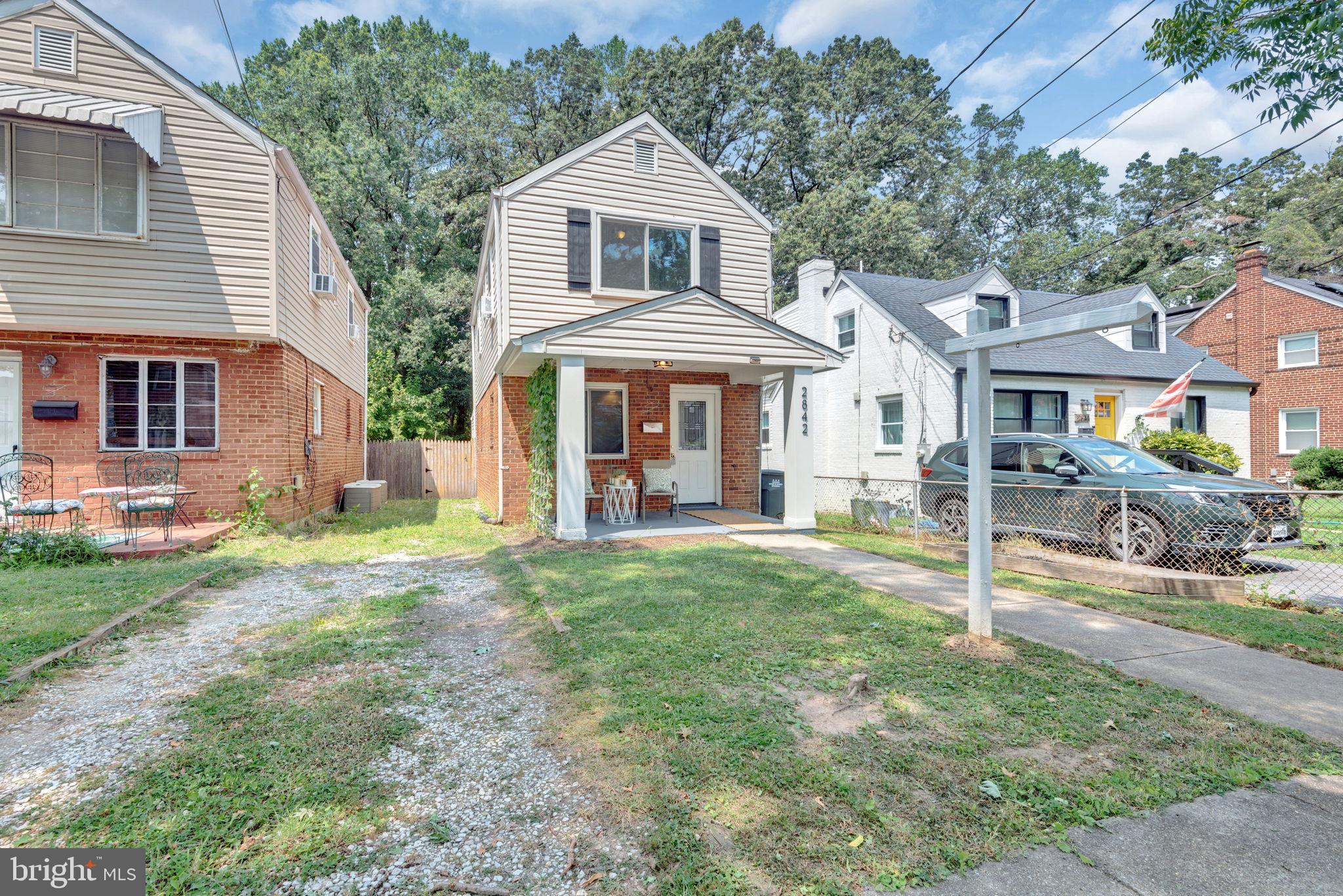 2842 30th Street Northeast Washington, DC 20018 - Photo 18 of 18 a front view of a house with a yard