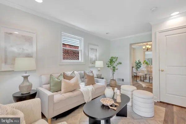 a living room with furniture and a lamp