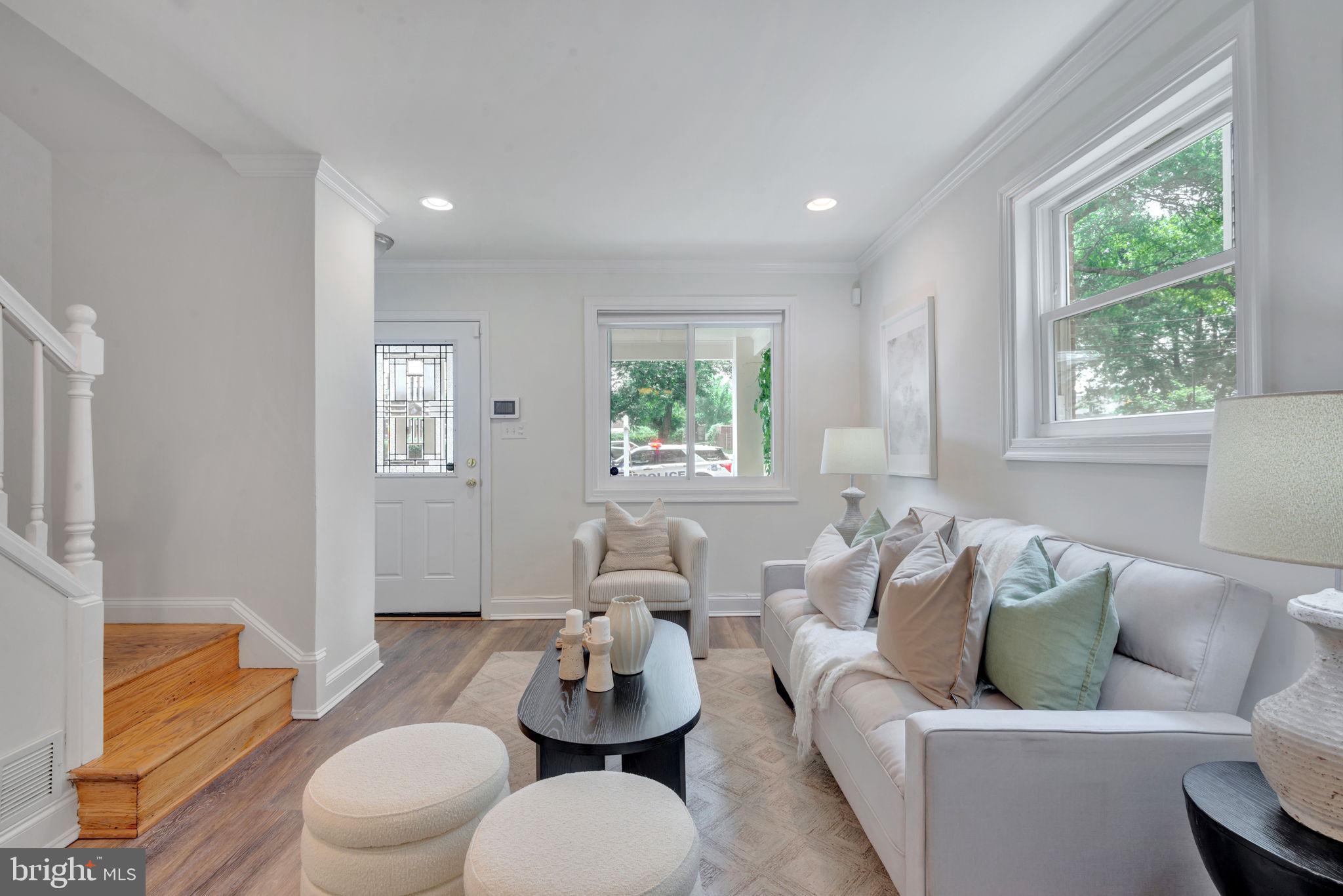 2842 30th Street Northeast Washington, DC 20018 - Photo 4 of 18 a living room with furniture and a window