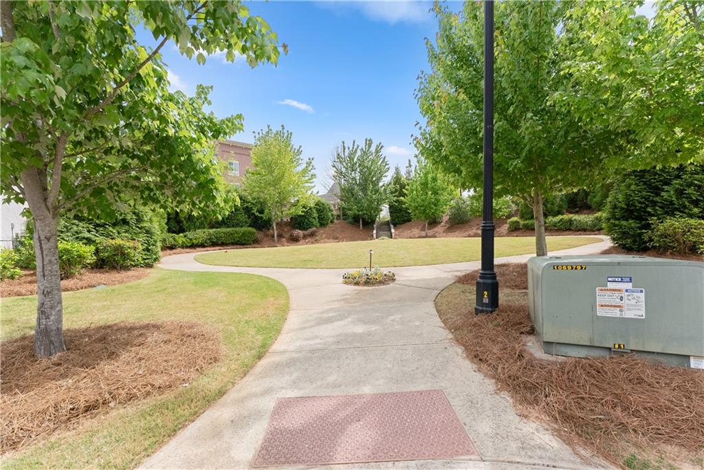 3206 Ridge Towne Place Duluth, GA 30096 - Photo 35 of 42 a view of a park with trees and a lake