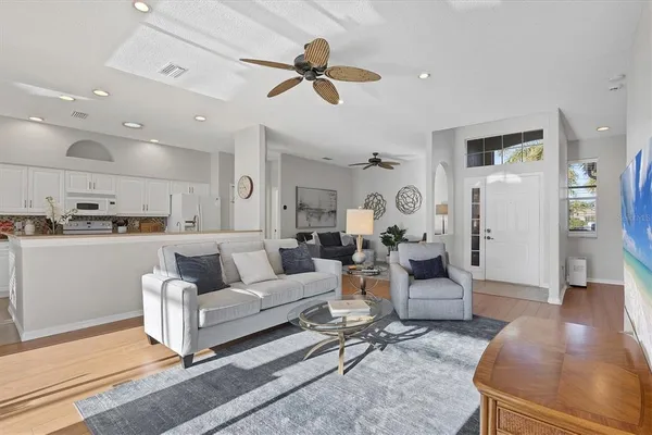 a kitchen with stainless steel appliances granite countertop a refrigerator and a stove top oven
