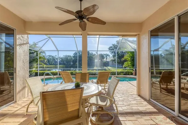 a dining room with furniture window and outside view