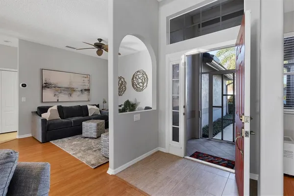 a living room with furniture and a large window