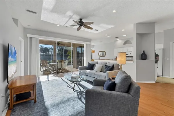 a living room with furniture and a large window