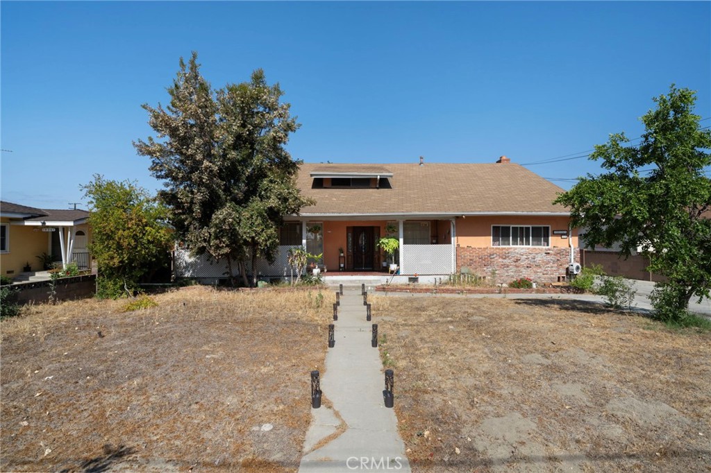 15355 Eucalyptus Avenue Bellflower, CA 90706 - Photo 1 of 20 a front view of a house with a porch