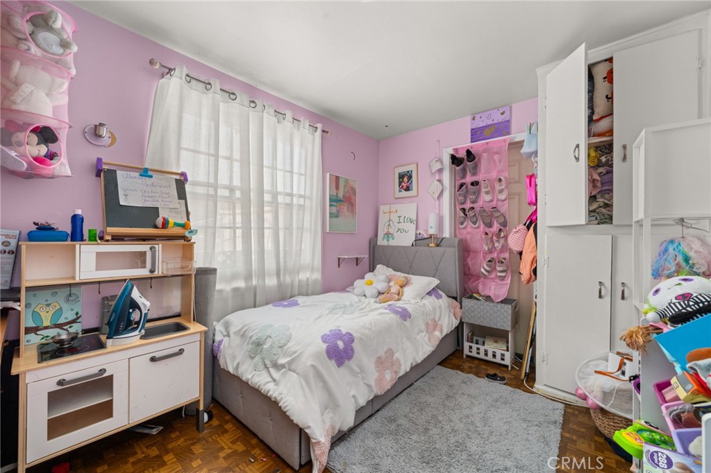 15355 Eucalyptus Avenue Bellflower, CA 90706 - Photo 14 of 20 a bedroom with a bed and a window