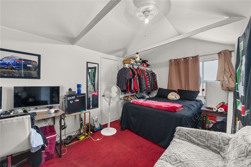 15355 Eucalyptus Avenue Bellflower, CA 90706 - Photo 17 of 20 a bedroom with a bed and a flat screen tv