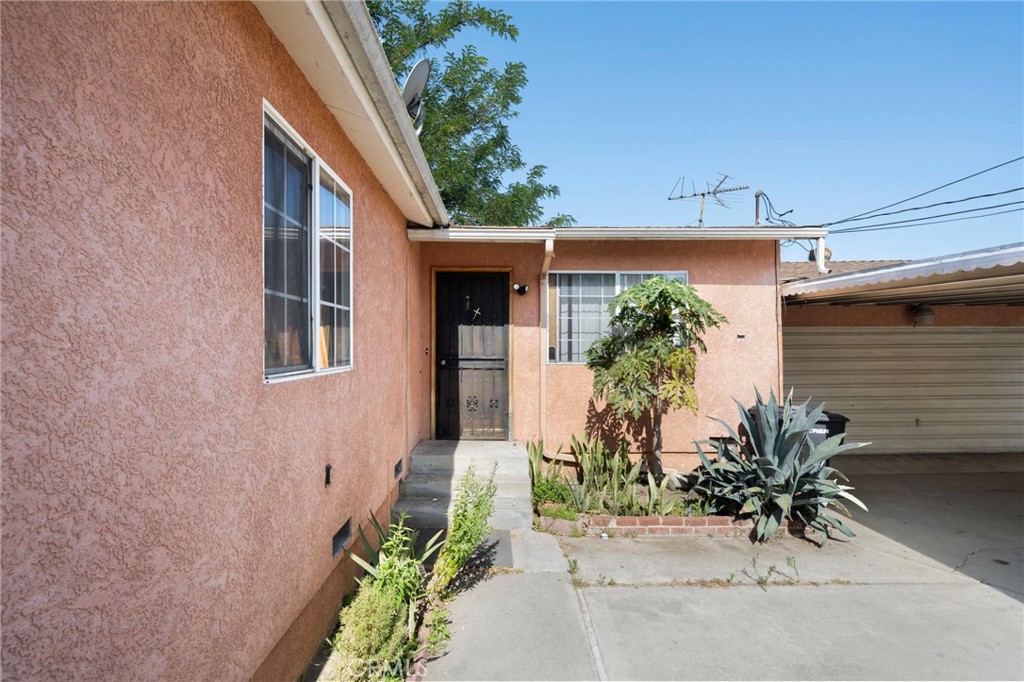 15355 Eucalyptus Avenue Bellflower, CA 90706 - Photo 20 of 20 front view of a house with potted plants