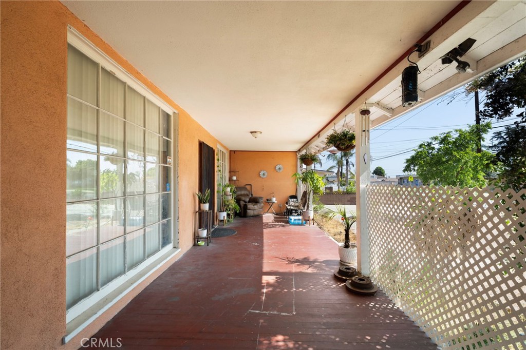 15355 Eucalyptus Avenue Bellflower, CA 90706 - Photo 3 of 20 a living room with furniture and a large window