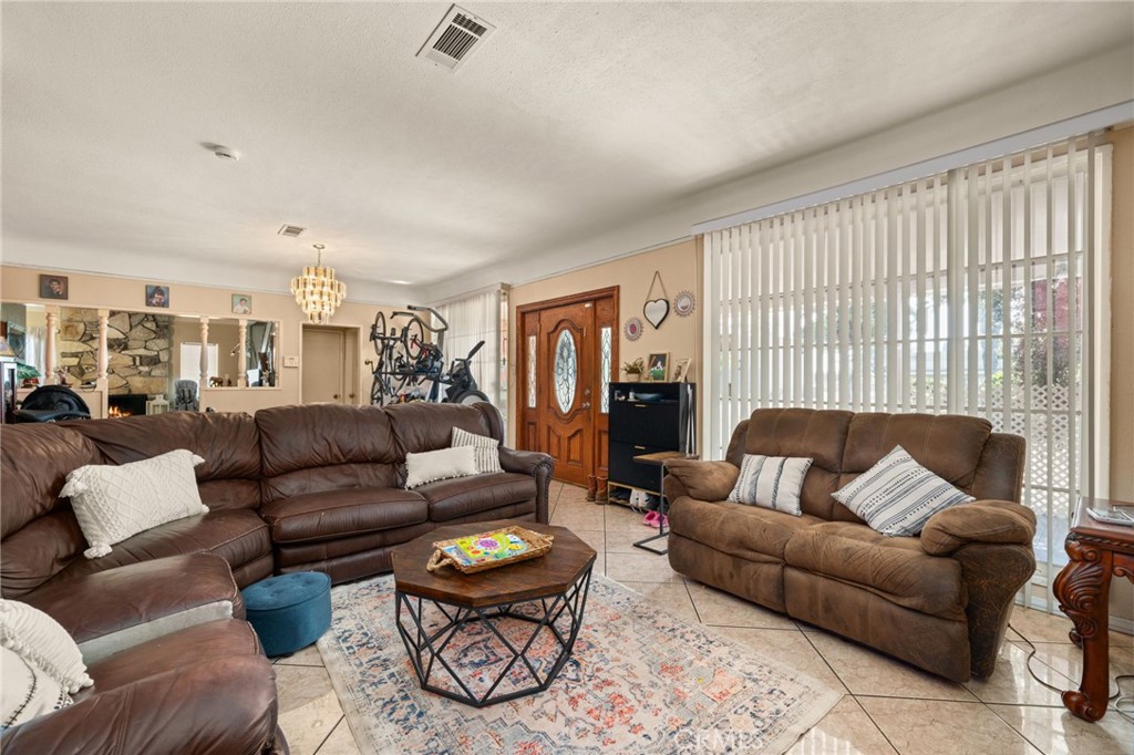 15355 Eucalyptus Avenue Bellflower, CA 90706 - Photo 5 of 20 a living room with furniture and a large window
