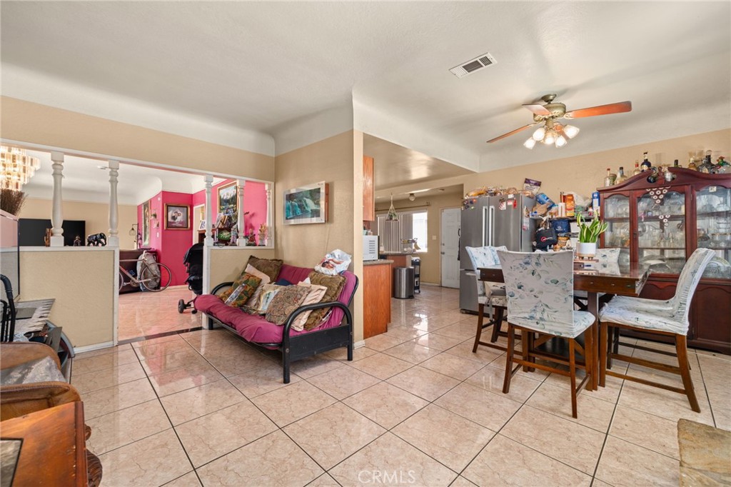 15355 Eucalyptus Avenue Bellflower, CA 90706 - Photo 10 of 20 a living room with furniture and a chandelier