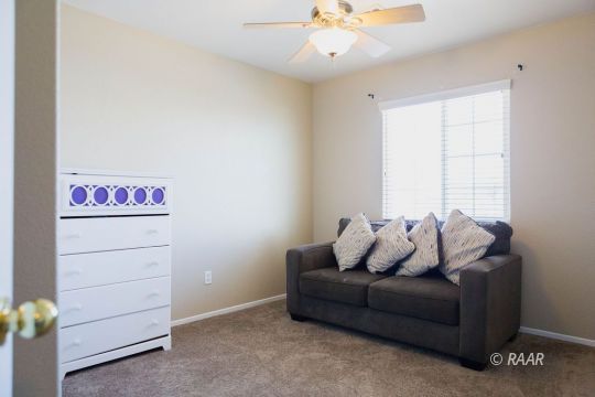 1129 Rebecca Avenue Ridgecrest, CA 93555 - Photo 21 of 34 a living room with furniture and a window