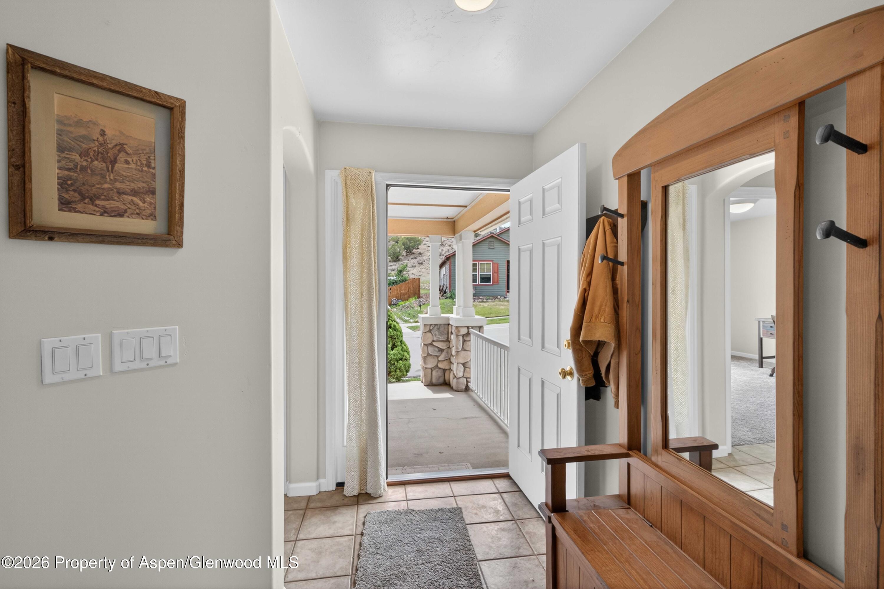 608 Lariat Loop New Castle, CO 81647 - Photo 13 of 32 a view of a hallway with wooden floor and entryway