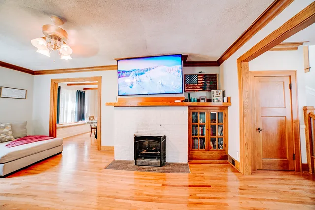 a living room with furniture and a chandelier