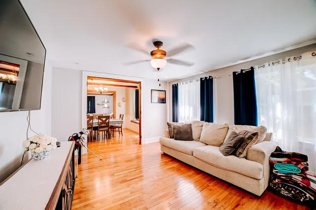 a bathroom with a sink vanity mirror and toilet
