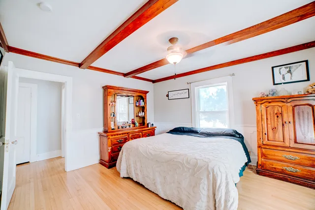 a living room filled with furniture and a chandelier