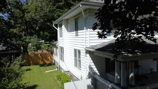 a view of house with backyard