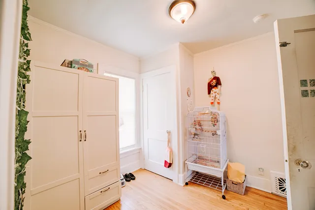 a bedroom with furniture and a window