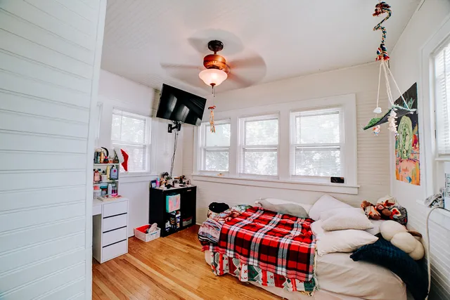 a view of empty room with cabinet and window
