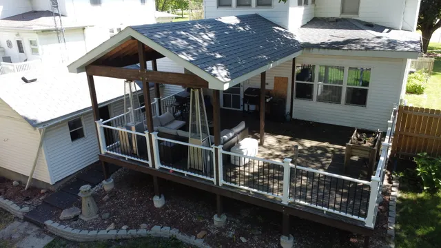 an aerial view of a house with a yard