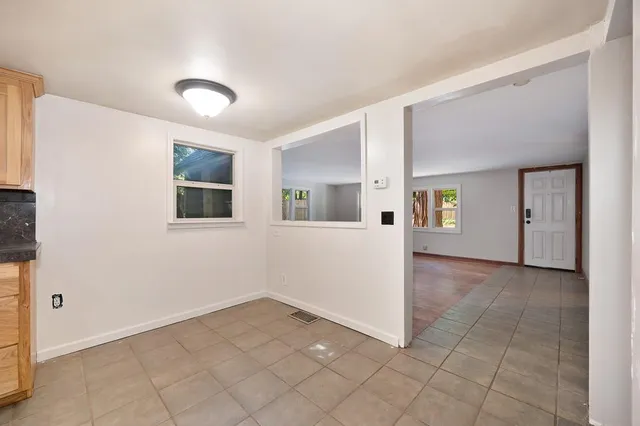 a bathroom with a sink vanity granite and a mirror