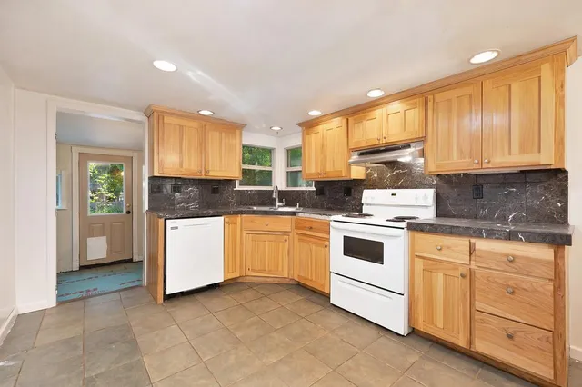 a backyard of a house with seating space