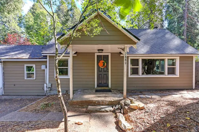 a front view of a house with a yard