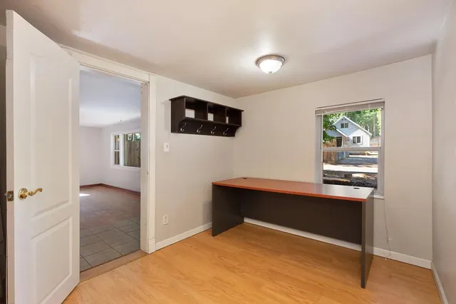 a kitchen with stainless steel appliances a stove a refrigerator and a fireplace
