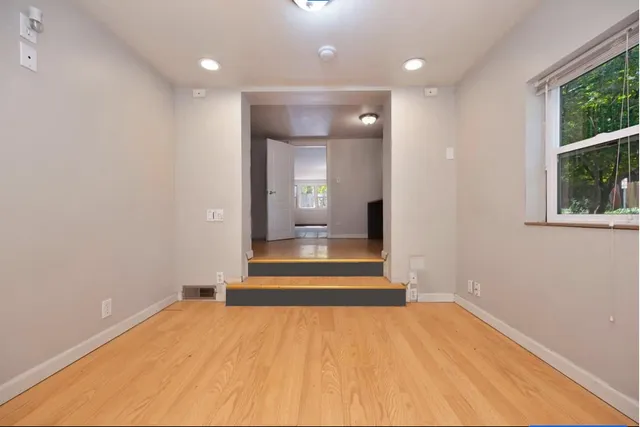 a big room with closet and a chandelier fan