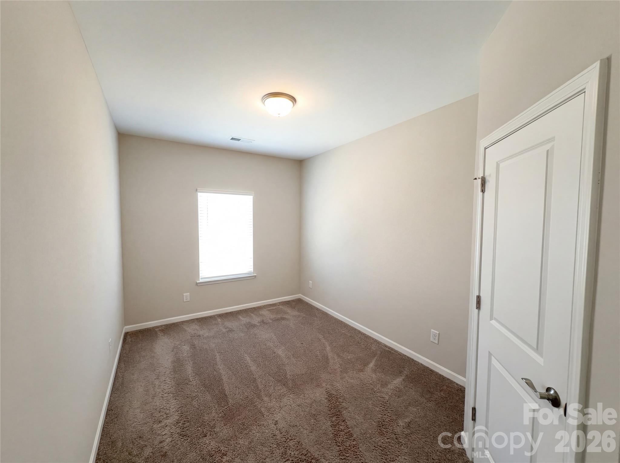 617 Ardsley Drive Locust, NC 28097 - Photo 7 of 23 an empty room with a window