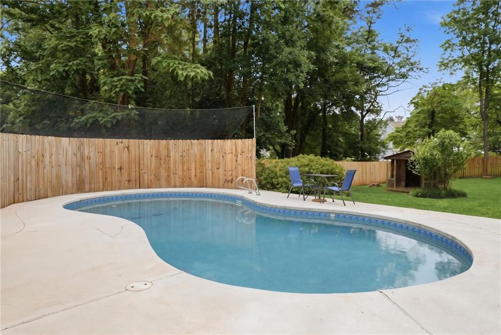338 Arbour Way Suwanee, GA 30024 - Photo 22 of 32 a view of outdoor space and swimming pool