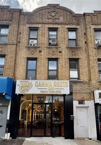 a view of a brick building with many windows