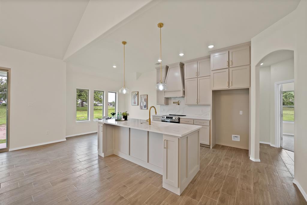 501 Harris Road Azle, TX 76020 - Photo 7 of 29 a kitchen with a sink a counter top space stainless steel appliances and a window