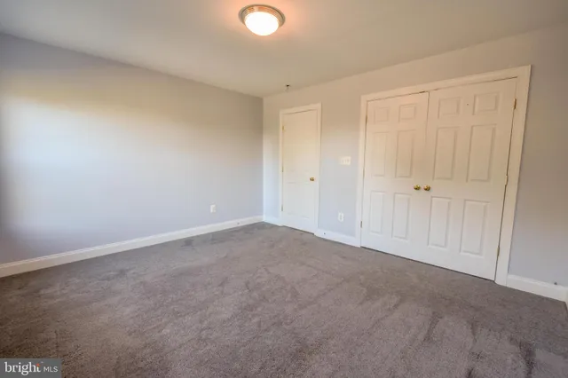 an empty room with a empty space and a window