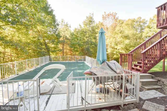 a view of a backyard with sitting area