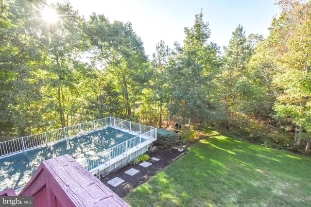 a view of balcony with deck and wooden floor