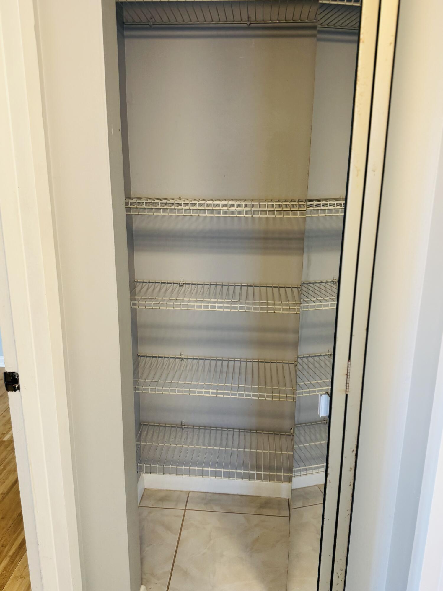 151 Brighton Drive, Unit D Boca Raton, FL 33434 - Photo 15 of 29 a view of staircase with white walls