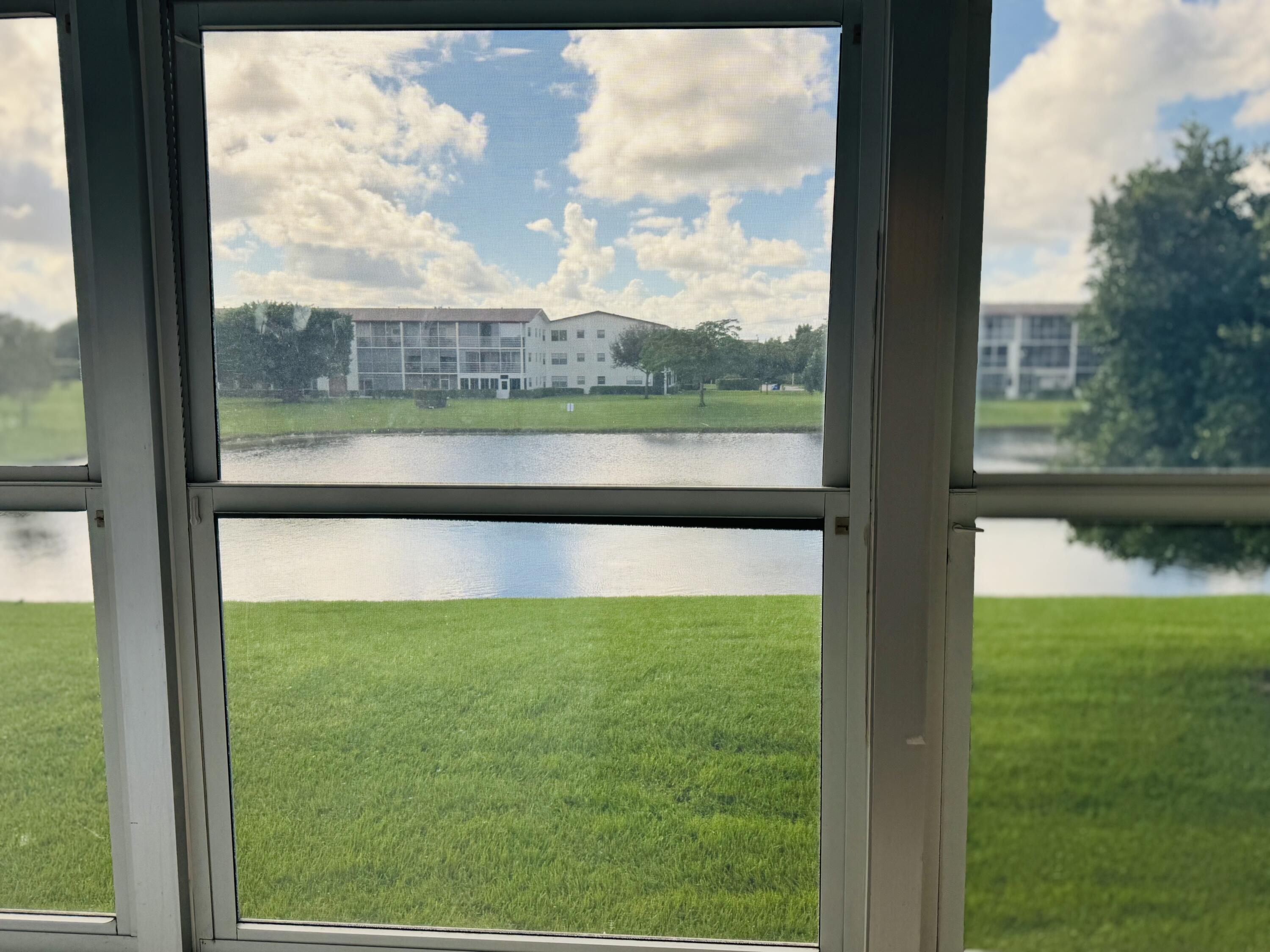 151 Brighton Drive, Unit D Boca Raton, FL 33434 - Photo 19 of 29 a view of lake from a window