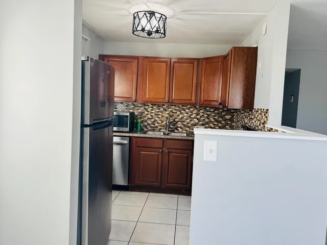 a view of a kitchen with a dishwasher and a cabinets