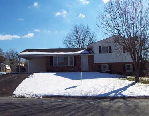 5614 Green Ridge Road Northwest Roanoke, VA 24019 - Photo 1 of 1 a front view of a house with a yard covered in snow