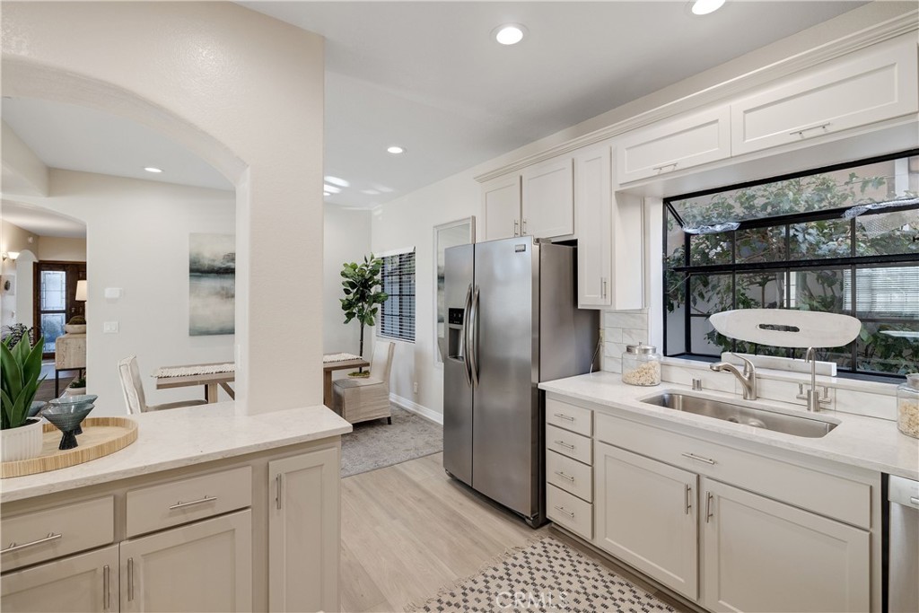 750 14th Street Manhattan Beach, CA 90266 - Photo 30 of 60 a kitchen with a sink stainless steel appliances and white cabinets