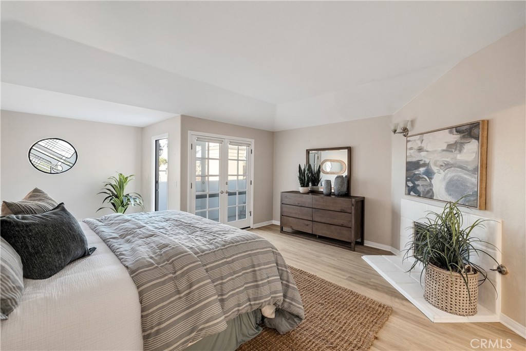 750 14th Street Manhattan Beach, CA 90266 - Photo 39 of 60 a bedroom with a bed and glass window