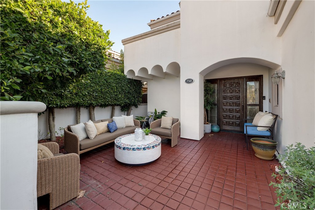 750 14th Street Manhattan Beach, CA 90266 - Photo 4 of 60 a view of a patio that has couple of chairs and a table