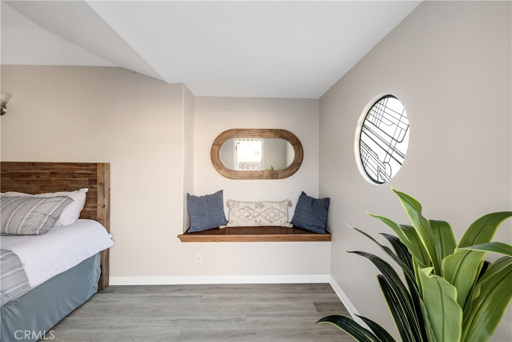 750 14th Street Manhattan Beach, CA 90266 - Photo 41 of 60 a living room with furniture and a potted plant