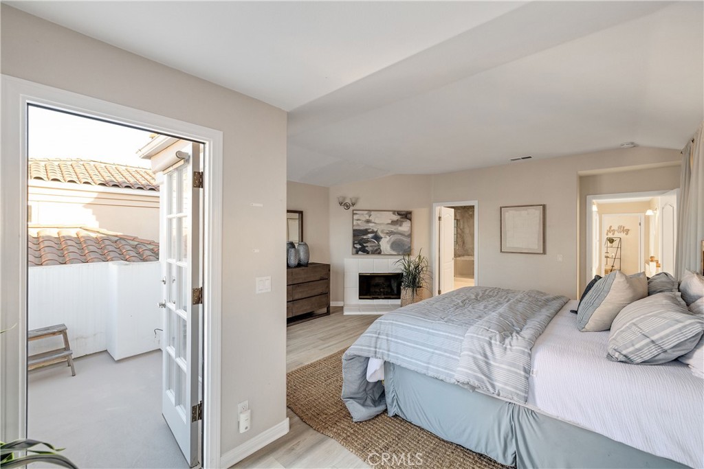 750 14th Street Manhattan Beach, CA 90266 - Photo 42 of 60 a bedroom with a bed and a refrigerator